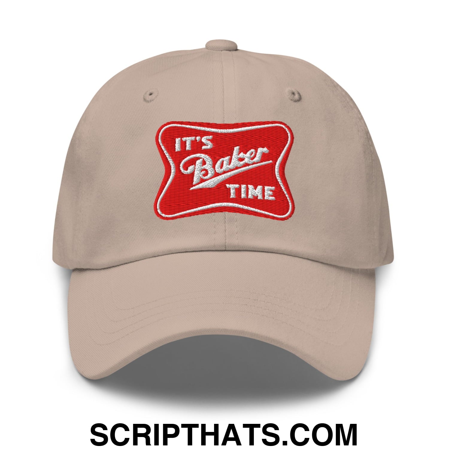 Beige unstructured dad hat featuring a red embroidered patch with white lettering reading its baker time