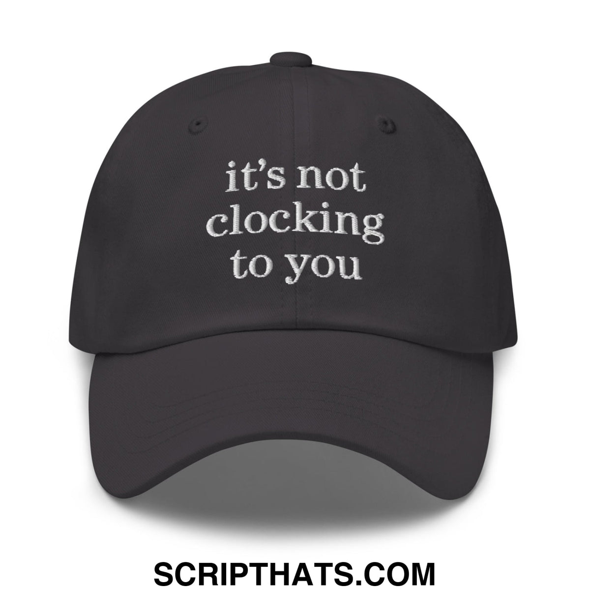 Black unstructured dad hat with white embroidered text its not clocking to you perfect for casual wear