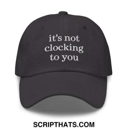 Black unstructured dad hat with white embroidered text its not clocking to you perfect for casual wear