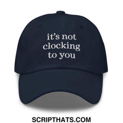 Navy blue embroidered unstructured dad hat with white text reading its not clocking to you for casual wear