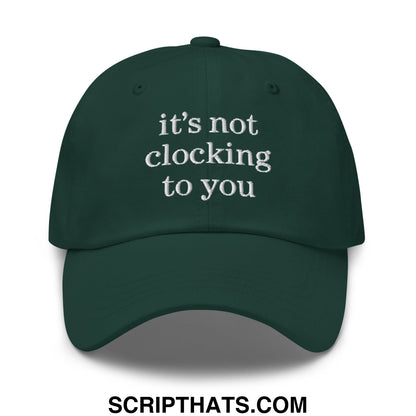 Dark green embroidered unstructured dad hat with white text reading its not clocking to you for casual wear