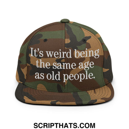 Camouflage snapback hat with white embroidered text it’s weird being the same age as old people flat bill brim