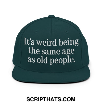 Dark green flat bill snapback hat with white embroidered text its weird being the same age as old people