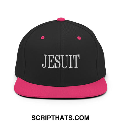 Black snapback hat with vibrant pink flat bill and button featuring white jesuit embroidery on front panel