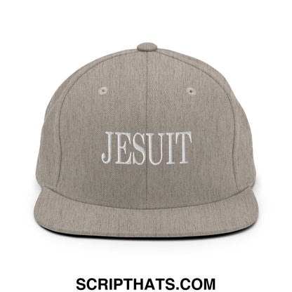 Gray snapback hat with white embroidered jesuit lettering and a flat bill brim in durable fabric