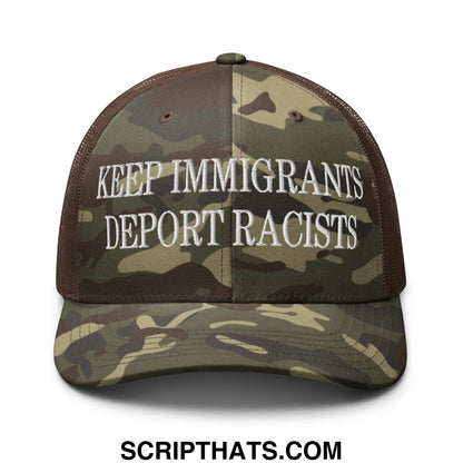 A camouflage mesh trucker hat embroidered with white text keep immigrants deport racists on the front