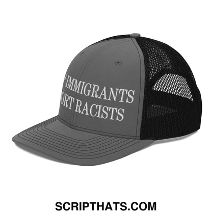 Gray and black mesh trucker hat with white embroidered immigrants not racists text on front panel