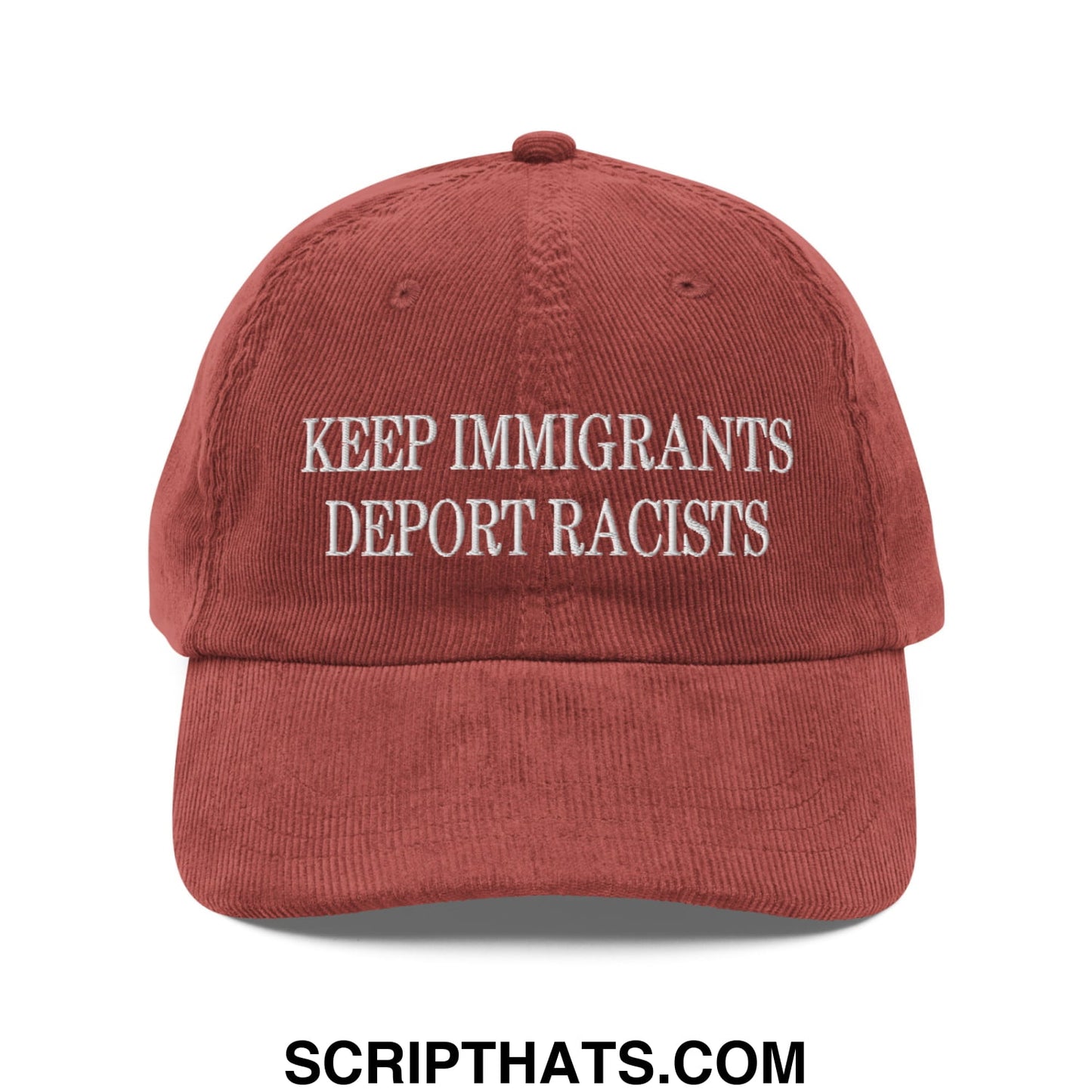 A rust-colored corduroy dad hat with white embroidered text keep immigrants deport racists on front