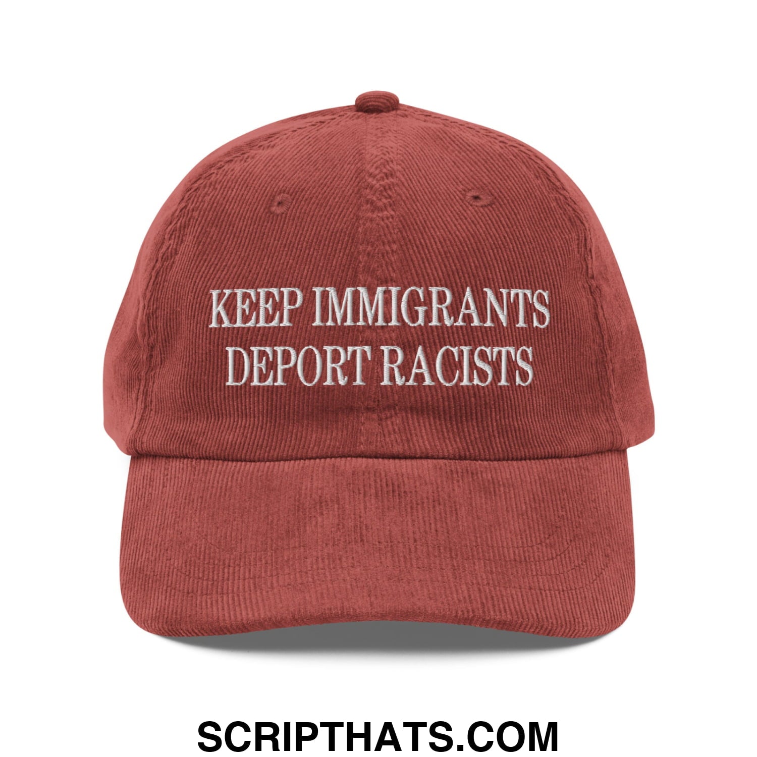 A rust-colored corduroy dad hat with white embroidered text keep immigrants deport racists on front