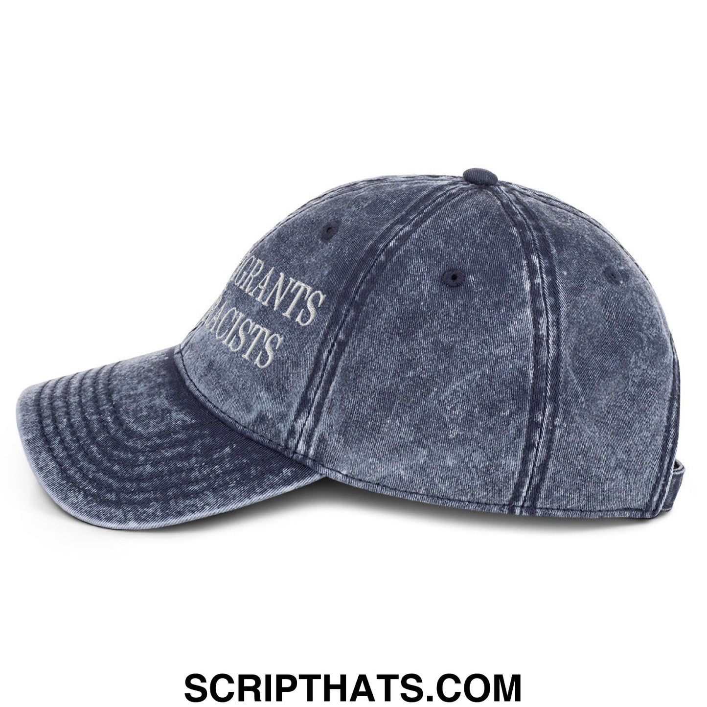 A faded navy blue denim dad hat with white embroidered text reading grants acists in a keep immigrants deport racists design