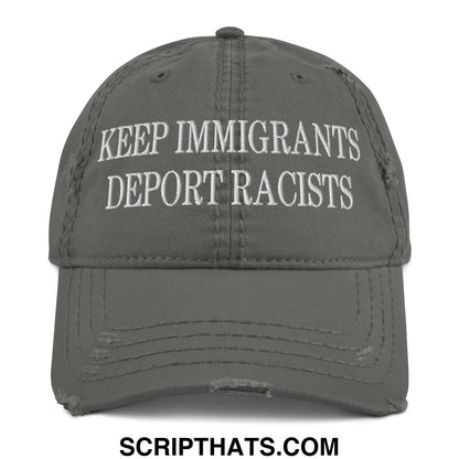 A distressed gray dad hat with white embroidered keep immigrants deport racists text on the front panel