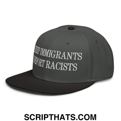 Dark gray flat brim snapback hat with white embroidered keep immigrants deport racists text on front panel