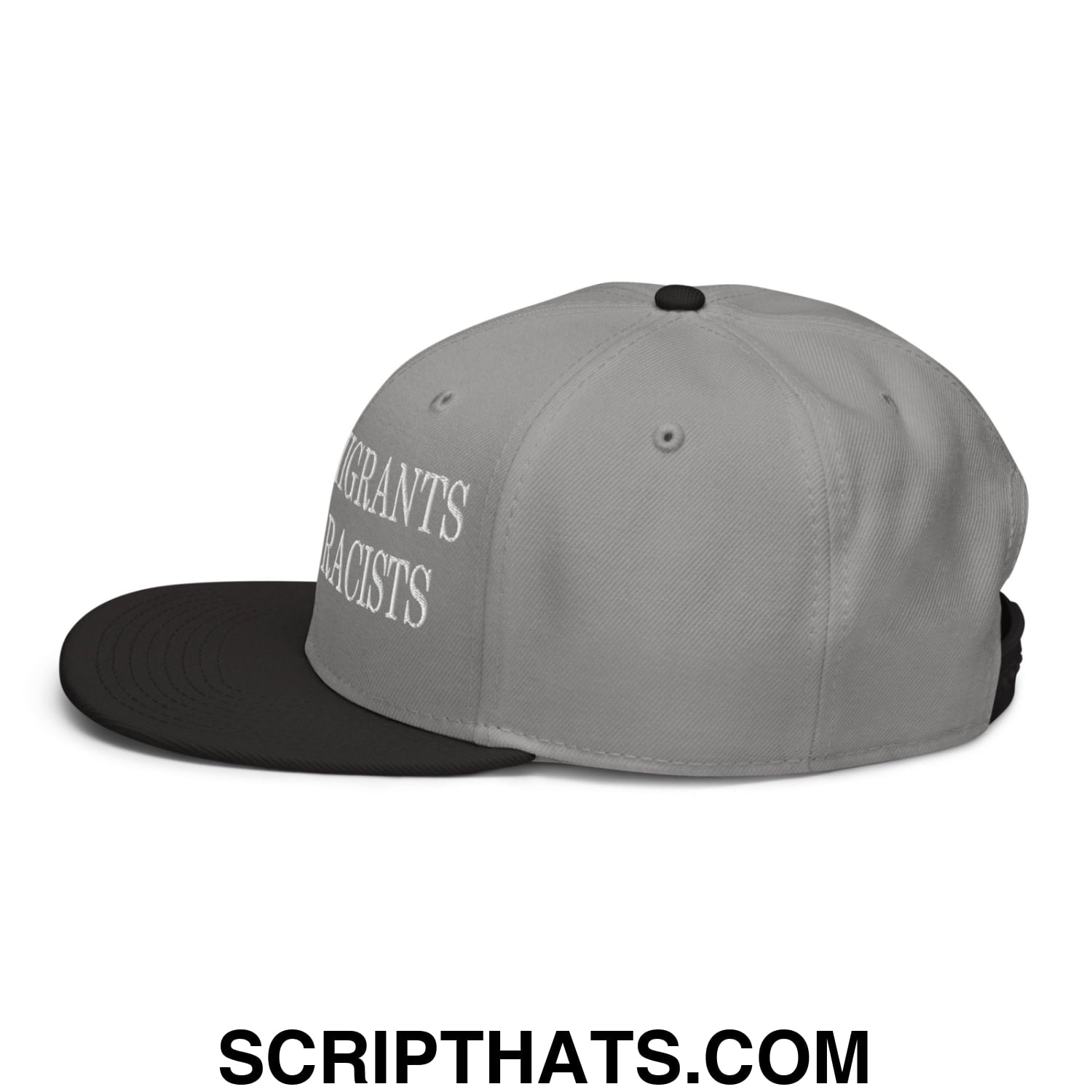Gray and black snapback hat with white embroidered text reading immigrants not racists on the side