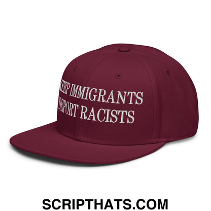 Maroon snapback cap with white embroidered keep immigrants deport racists text and a flat brim bill design