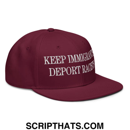 Maroon snapback cap with white embroidered keep immigrants deport racists text and flat brim bill design