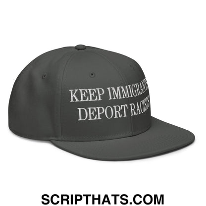 Dark gray snapback cap with white embroidered keep immigrants deport racists text and flat brim bill design