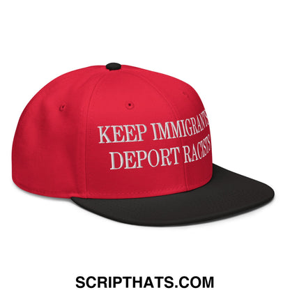 Red snapback flat brim hat with black brim and embroidered white text keep immigrants deport racists