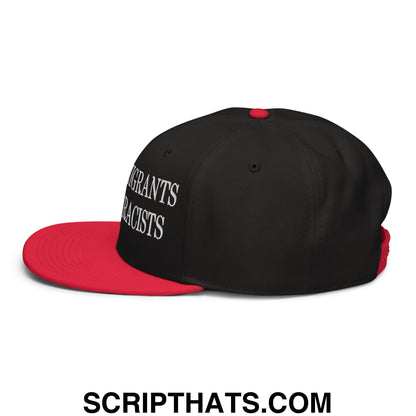 Black and red snapback cap with white embroidered text migrants not racists on the side from keep immigrants deport racists collection