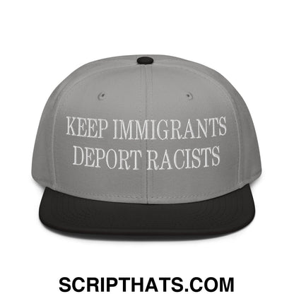 Gray snapback cap with black brim and white embroidered text keep immigrants deport racists in flat bill design