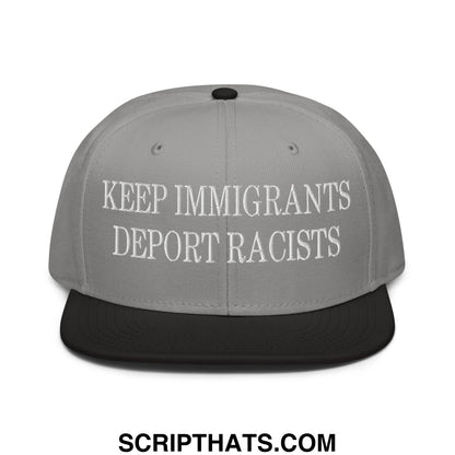 Gray snapback cap with black brim and white embroidered text keep immigrants deport racists in flat bill design