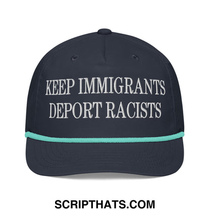 Dark navy baseball cap with white embroidered keep immigrants deport racists text and teal brim trim rope hat