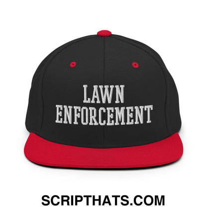 Black and red snapback hat with lawn enforcement embroidered in white on flat bill brim for outdoor use