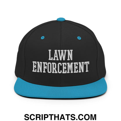 Black snapback hat with teal brim and button featuring white embroidered lawn enforcement text on front