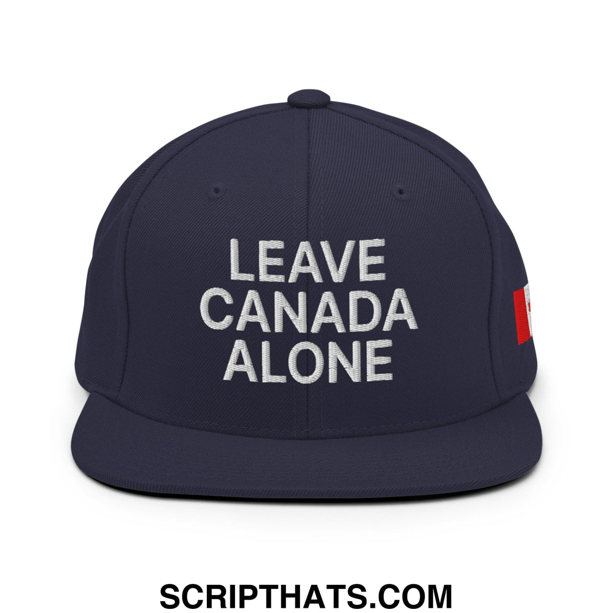 Navy blue snapback hat with white embroidered leave canada alone text and red Canadian flag patch on the side
