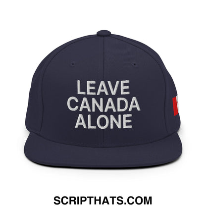 Navy blue snapback hat with white embroidered leave canada alone text and red Canadian flag patch on the side