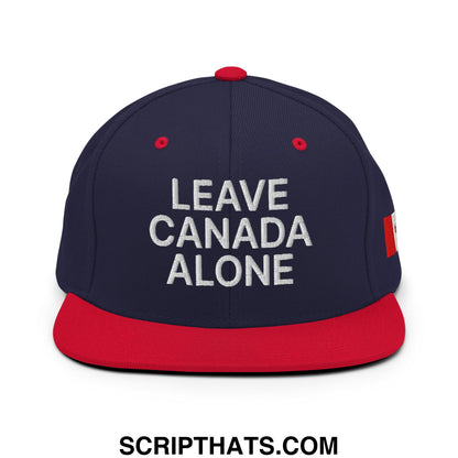 Navy blue and red snapback hat with white leave canada alone embroidery and canadian flag patch on the side