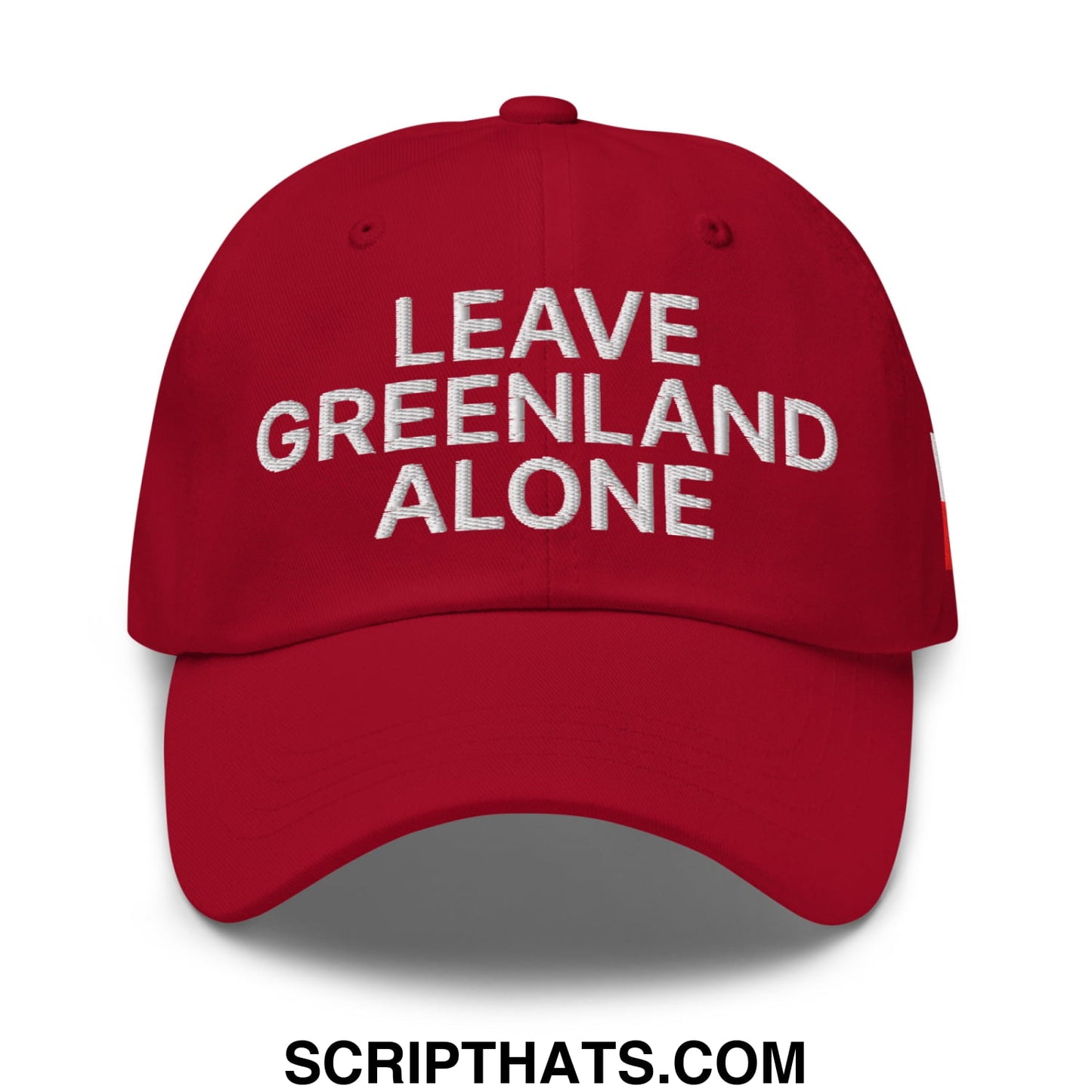 Red embroidered unstructured dad hat with white leave greenland alone text for casual wear