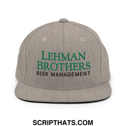 Gray snapback cap with embroidered green and black lehman brothers risk management text on flat bill brim