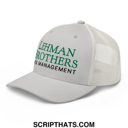 White mesh trucker hat with green and black embroidered lehman brothers risk management text on the front