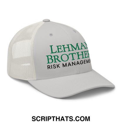 A white mesh back trucker hat with embroidered green lehman brothers risk management text on front panel