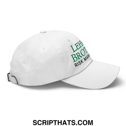 White unstructured dad hat with green embroidered lehman brothers risk management text on the front