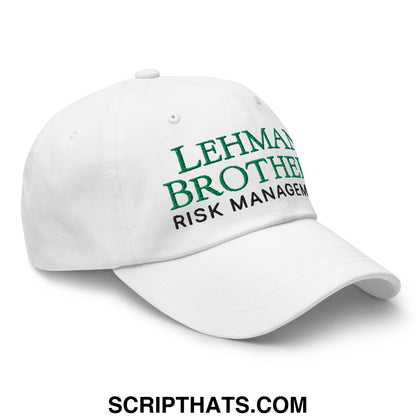 White unstructured dad hat with embroidered green and black lehman brothers risk management text on front