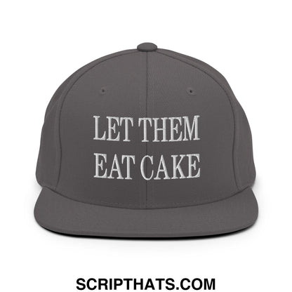 Gray snapback hat with white embroidered let them eat cake text and a flat bill brim design