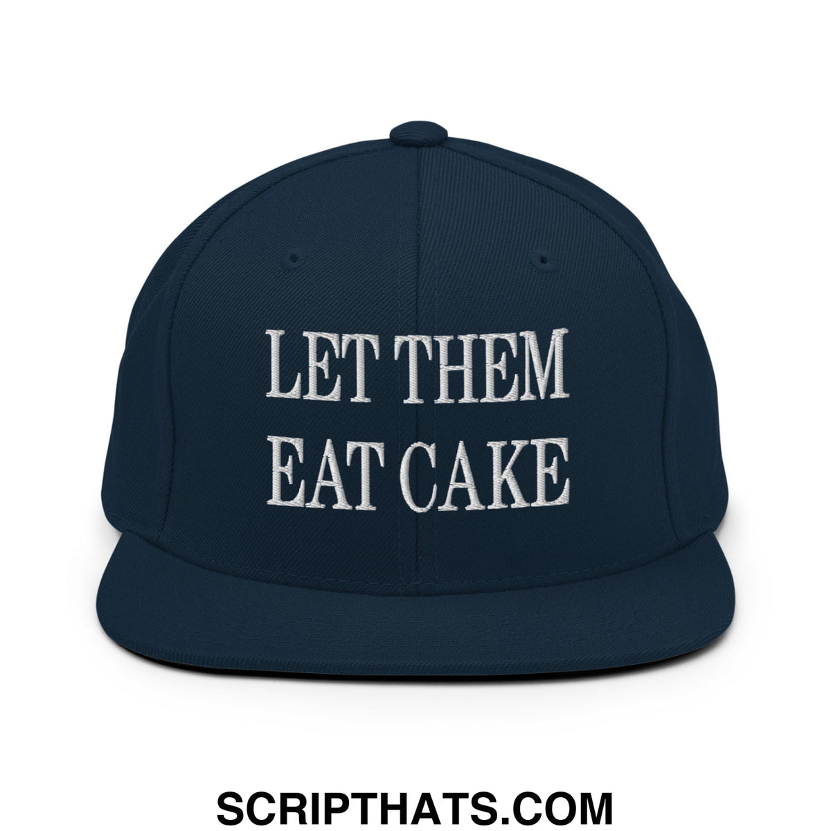 Navy blue snapback cap with white embroidered let them eat cake text and flat bill brim design