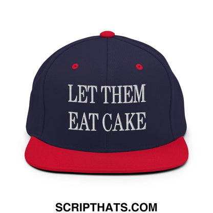 Navy blue and red snapback hat with flat bill and white embroidered let them eat cake text on front