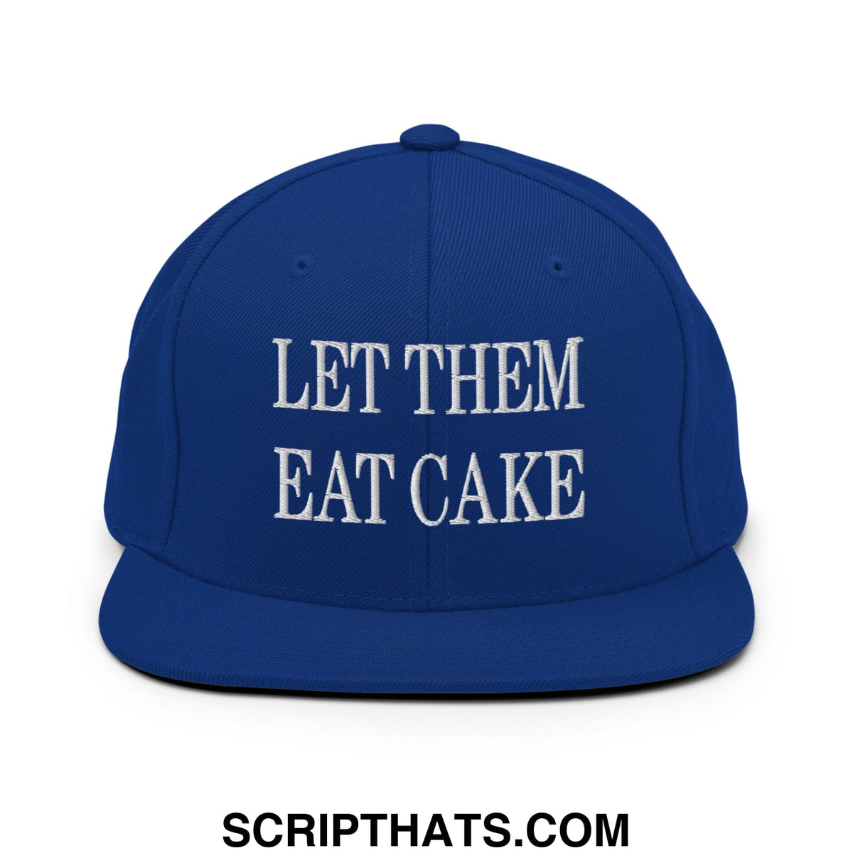 Royal blue snapback hat with white embroidered let them eat cake text and flat bill brim design