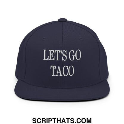 Navy blue snapback cap with white embroidered lets go taco text and flat bill brim for casual wear