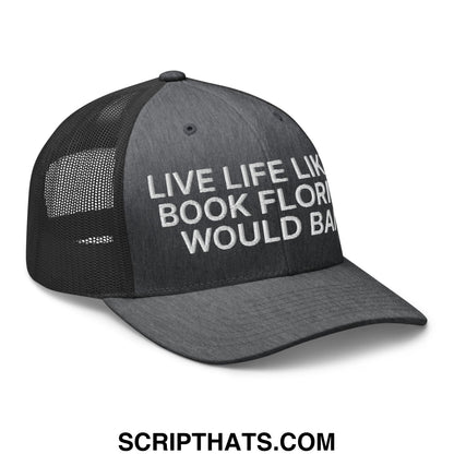 Black mesh trucker hat with white embroidered live life like a book florida would ban text on front panel