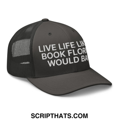 Black mesh trucker hat with white embroidered live life like a book florida would ban text on front panel