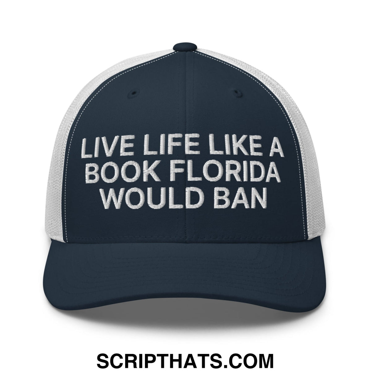 A navy blue and white mesh trucker hat embroidered with live life like a book florida would ban in a bold font