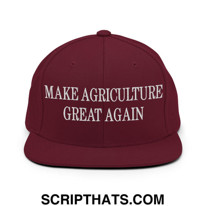 Maroon snapback cap with white embroidered make agriculture great again text and flat bill brim design