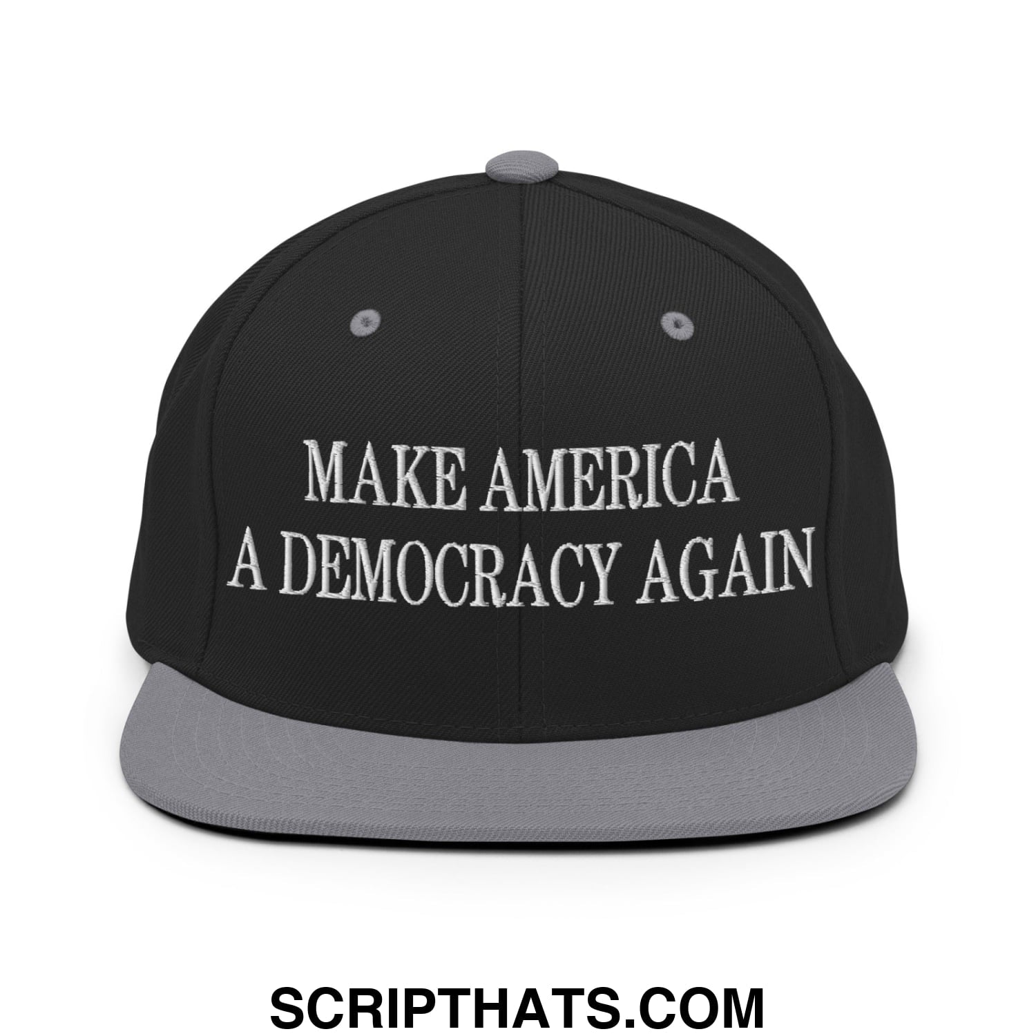 Black snapback cap with gray flat bill brim and white embroidered text make america a democracy again