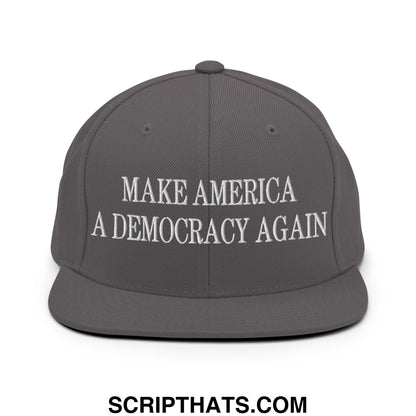 Gray snapback hat with white embroidered make america a democracy again text and flat bill brim design