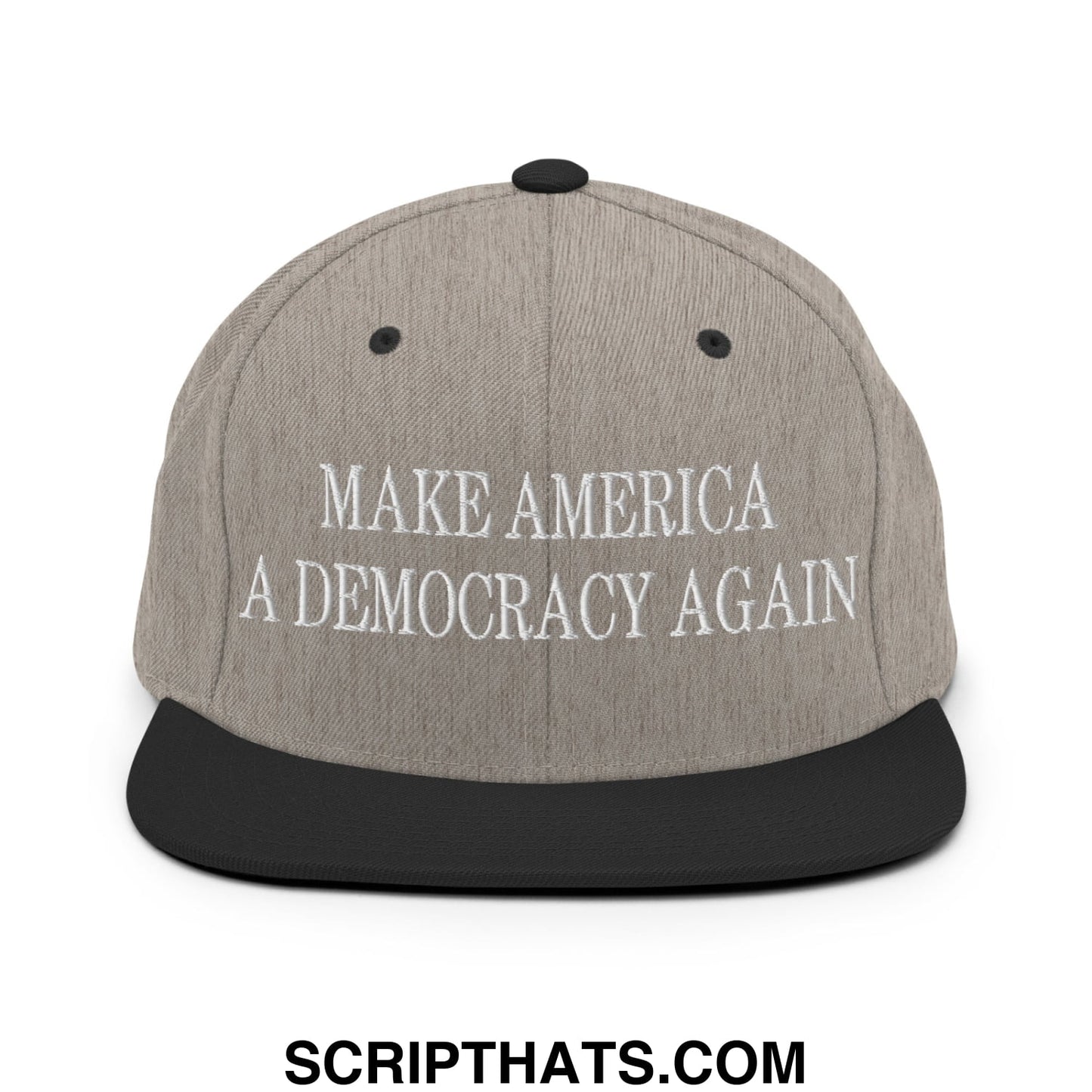 Gray snapback hat with black brim featuring embroidered white text make America a democracy again on the front