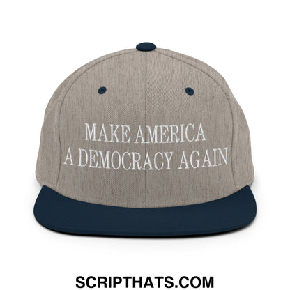 Gray and navy blue snapback hat with white embroidered make america a democracy again text and flat bill brim