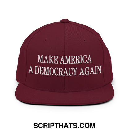 Maroon flat bill brim snapback hat with white embroidered make america a democracy again text